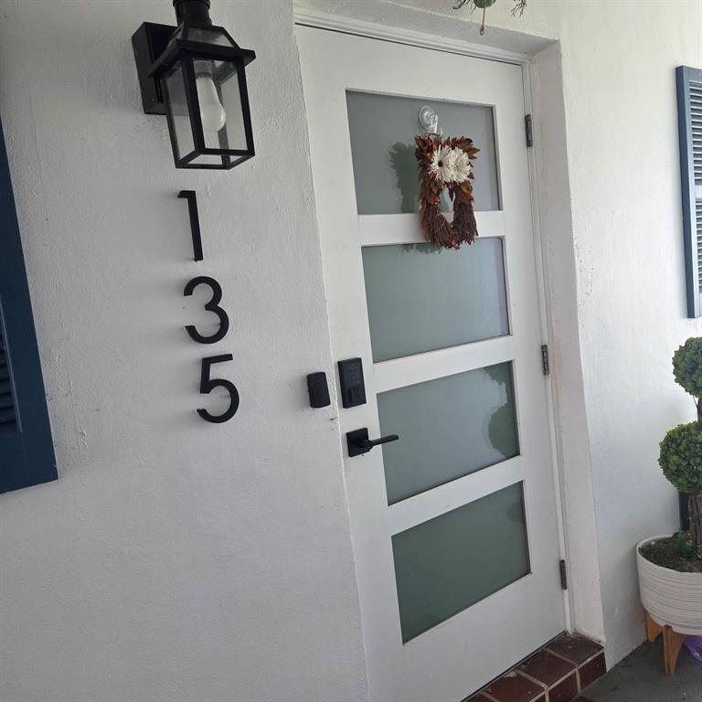 300 Southwest Golfview Terrace, Unit 135 Boynton Beach, FL 33426 - Photo 3 of 25 a view of hallway with washer and dryer