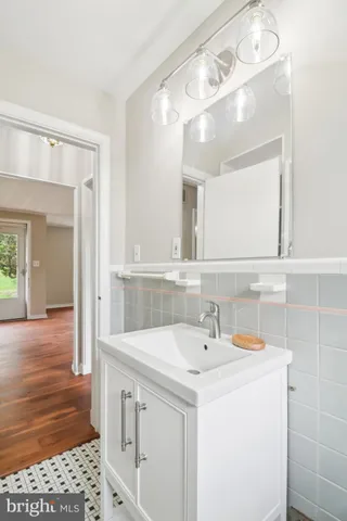 a view of a room with wooden floor and window