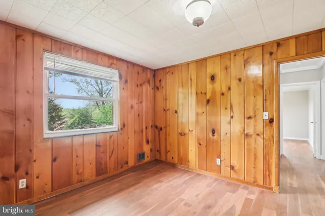 a view of a room with wooden walls