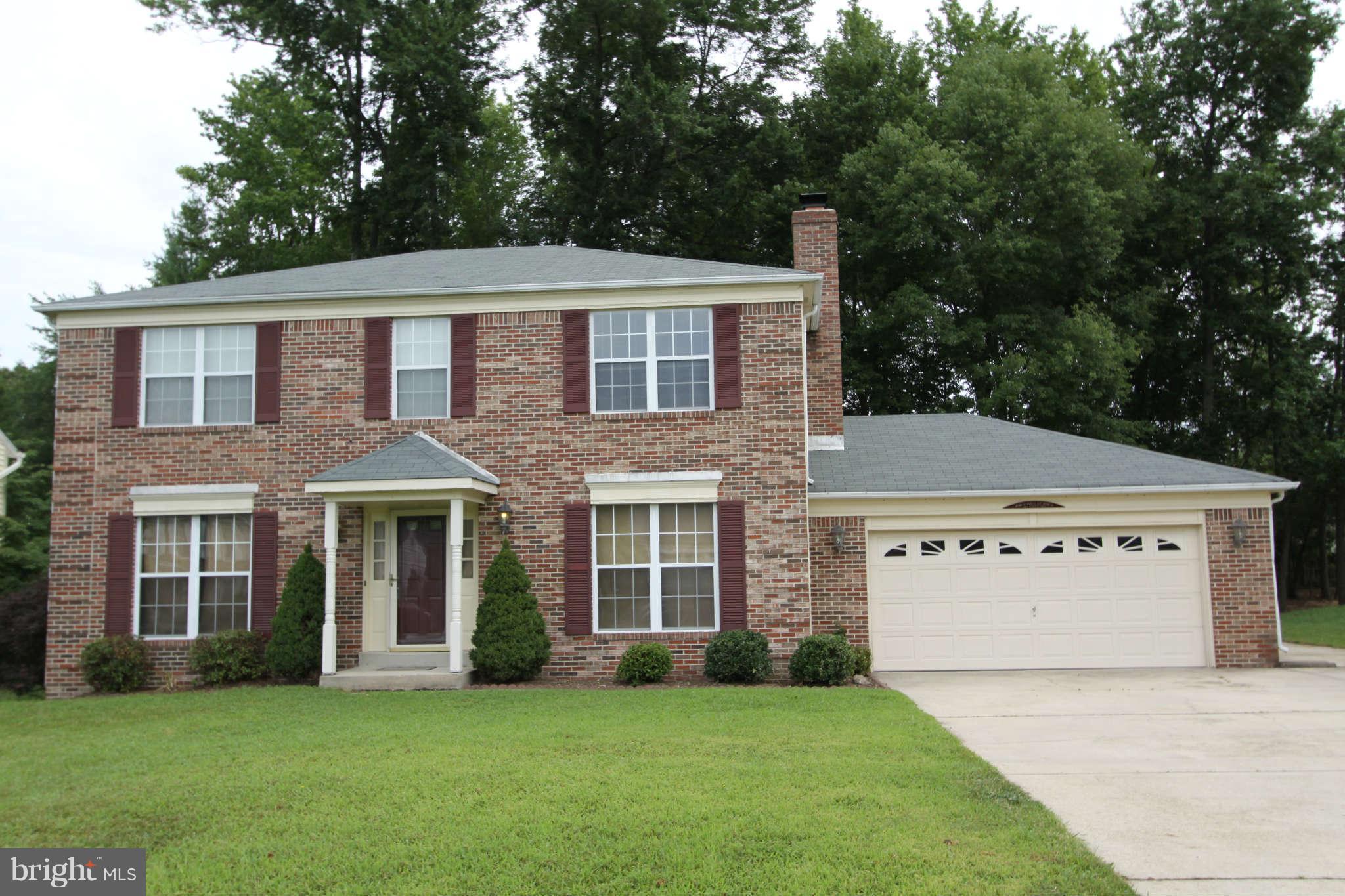 13370 Green Pine Road Waldorf, MD 20601 - Photo 1 of 16 a front view of a house with a garden
