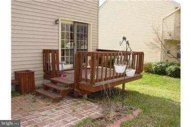 13370 Green Pine Road Waldorf, MD 20601 - Photo 13 of 16 a view of a wooden deck with a bench