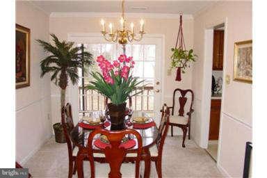 13370 Green Pine Road Waldorf, MD 20601 - Photo 4 of 16 a view of a dining room with furniture and a chandelier