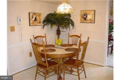 13370 Green Pine Road Waldorf, MD 20601 - Photo 9 of 16 a view of a dining room with furniture and chandelier