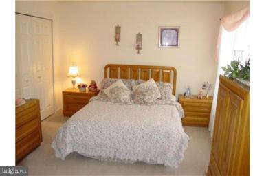 13370 Green Pine Road Waldorf, MD 20601 - Photo 10 of 16 a bedroom with a bed and a couch