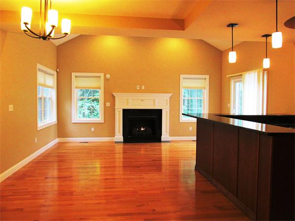 313 South Main Street Andover, MA 01810 - Photo 12 of 26 a view of a big room with wooden floor a fireplace and windows