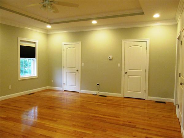 313 South Main Street Andover, MA 01810 - Photo 13 of 26 an empty room with wooden floor and windows