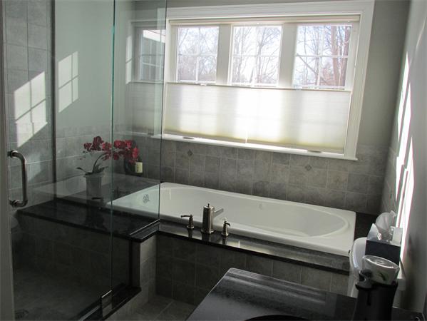 313 South Main Street Andover, MA 01810 - Photo 14 of 26 a bathroom with a sink and a bathtub