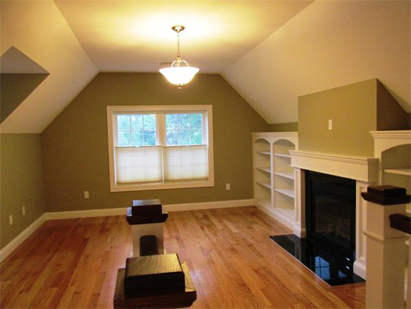 313 South Main Street Andover, MA 01810 - Photo 19 of 26 a living room with furniture and a fireplace