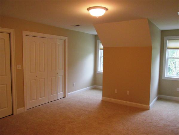 313 South Main Street Andover, MA 01810 - Photo 22 of 26 an empty room with windows & cabinet