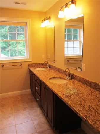 313 South Main Street Andover, MA 01810 - Photo 24 of 26 a bathroom with a granite countertop sink and a window