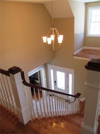 313 South Main Street Andover, MA 01810 - Photo 5 of 26 a view of staircase with wooden floor and a window