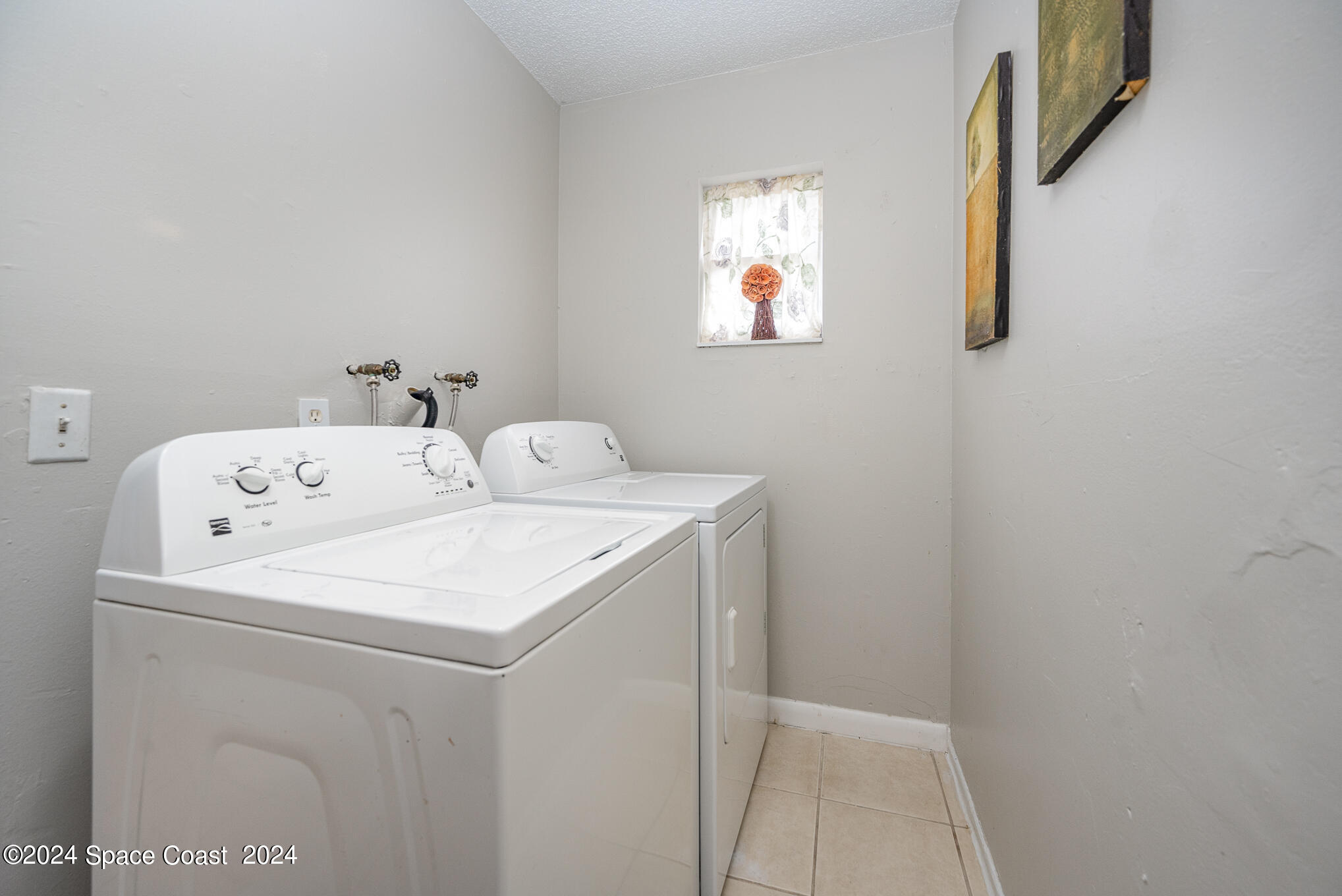889-881 Sarno Road Melbourne, FL 32935 - Photo 11 of 25 a utility room with dryer and washer