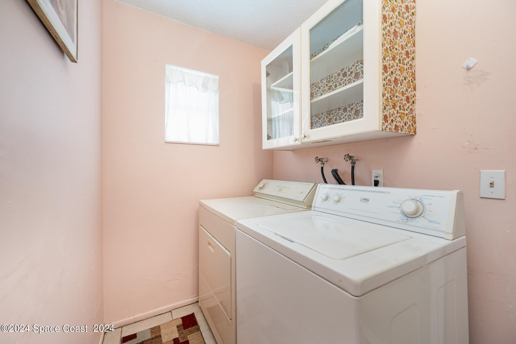 889-881 Sarno Road Melbourne, FL 32935 - Photo 19 of 25 a utility room with dryer and washer