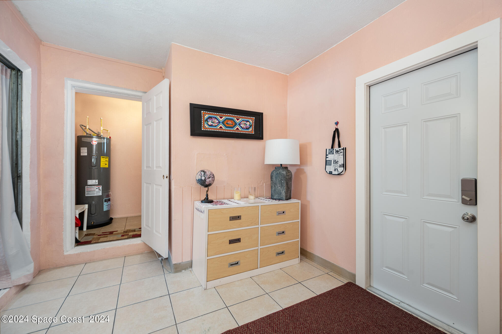 889-881 Sarno Road Melbourne, FL 32935 - Photo 20 of 25 a view of room with window and furniture