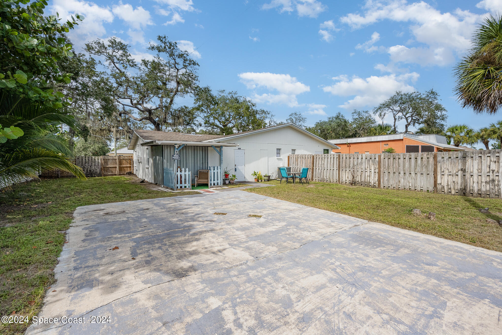 889-881 Sarno Road Melbourne, FL 32935 - Photo 22 of 25 a view of house with outdoor space and sitting area