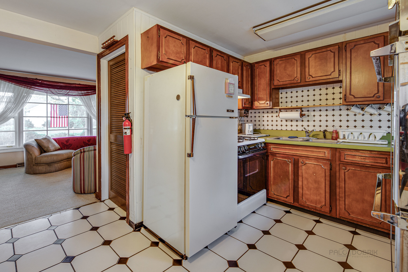 54 North Rohlwing Road Palatine, IL 60074 - Photo 11 of 24 a white refrigerator freezer sitting inside of a kitchen