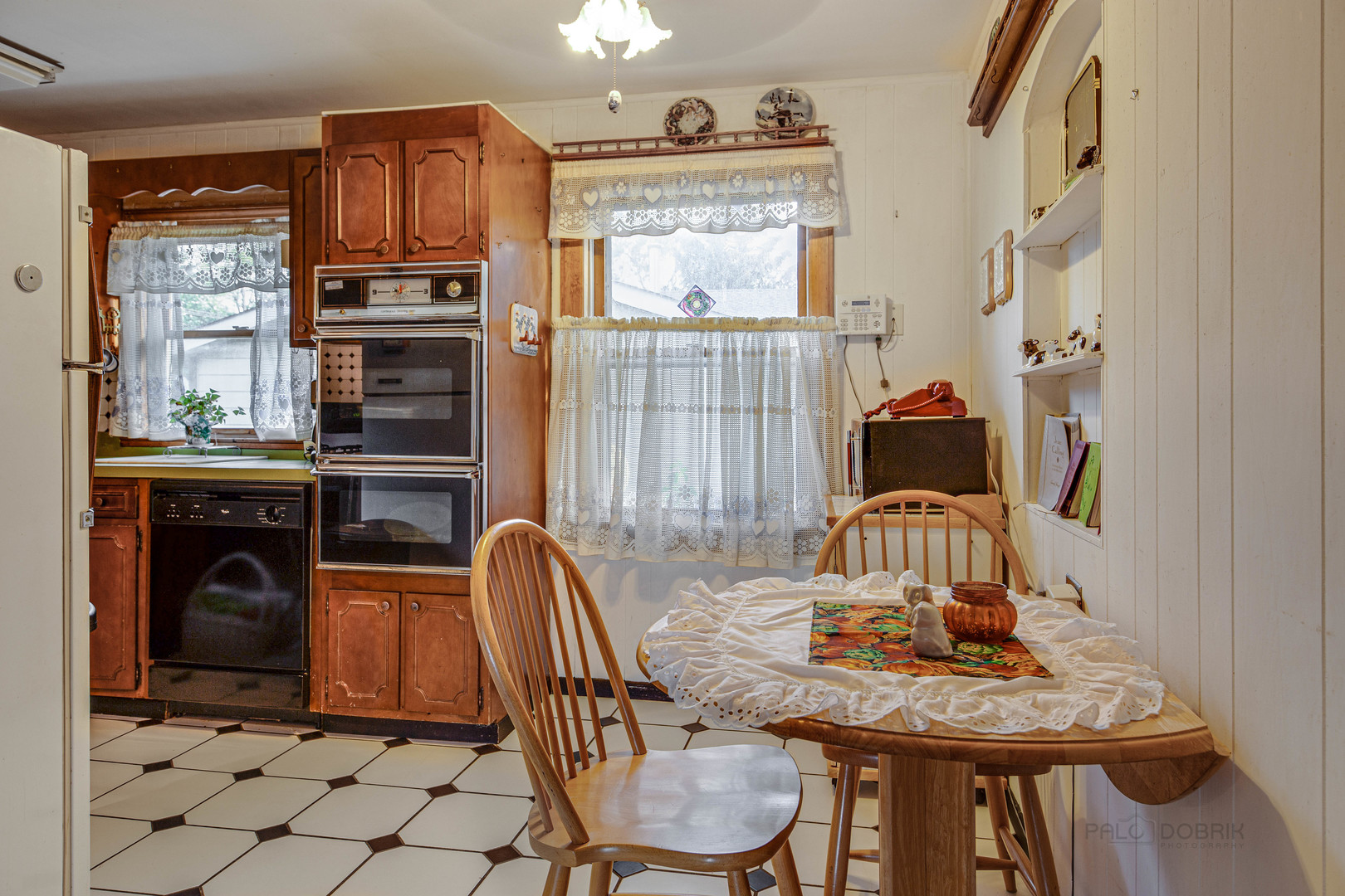 54 North Rohlwing Road Palatine, IL 60074 - Photo 13 of 24 a view of a dining room with furniture window and wooden floor