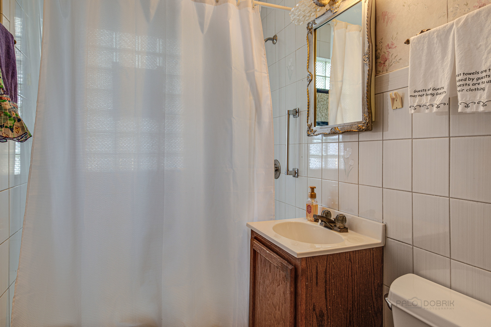 54 North Rohlwing Road Palatine, IL 60074 - Photo 17 of 24 a bathroom with a sink toilet and mirror