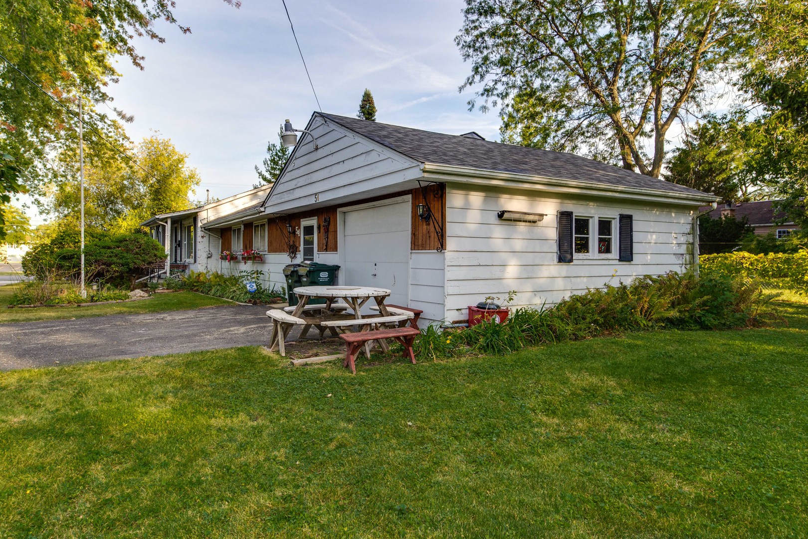 54 North Rohlwing Road Palatine, IL 60074 - Photo 23 of 24 a backyard of a house with table and chairs