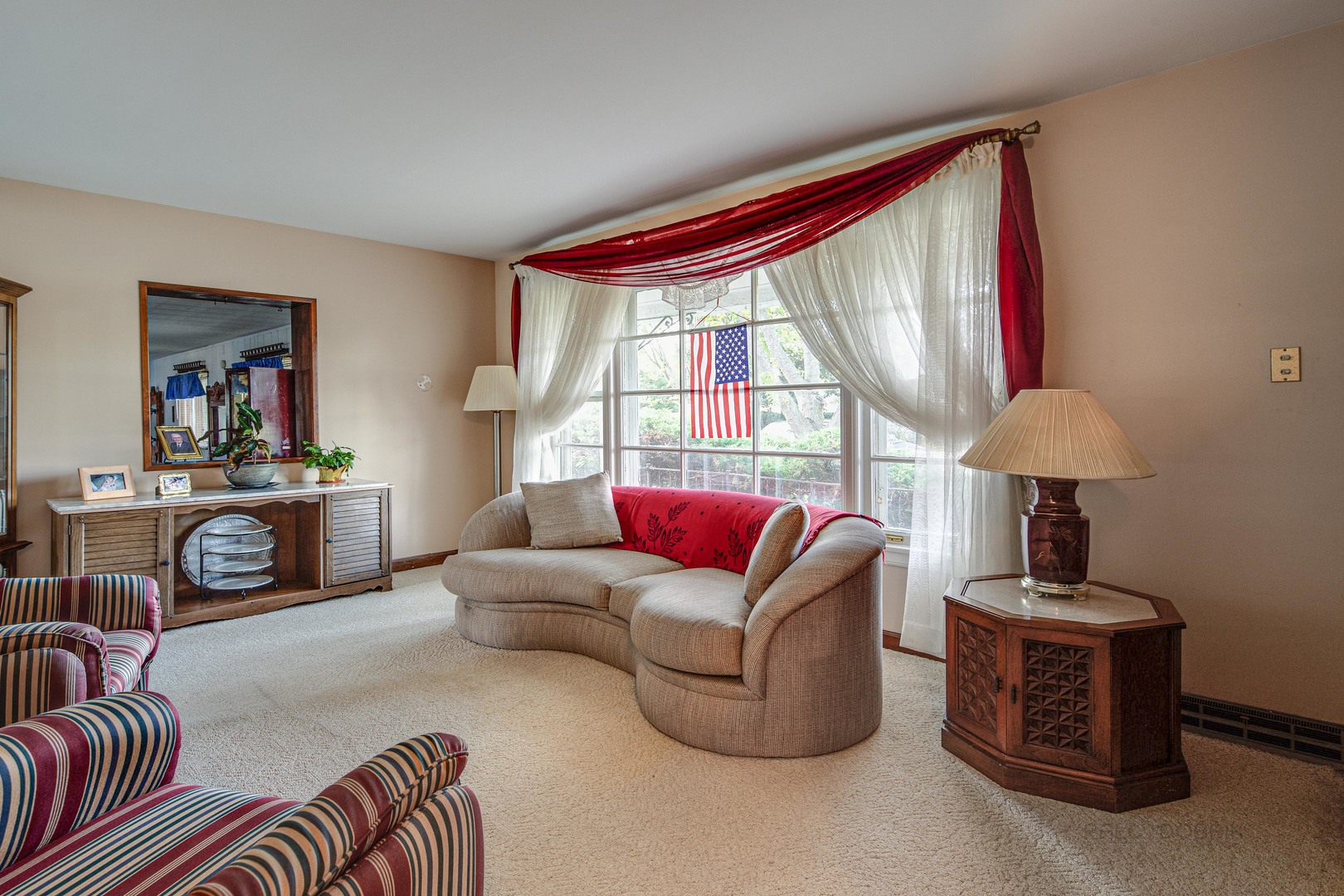 54 North Rohlwing Road Palatine, IL 60074 - Photo 4 of 24 a living room with furniture a flat screen tv and a large window