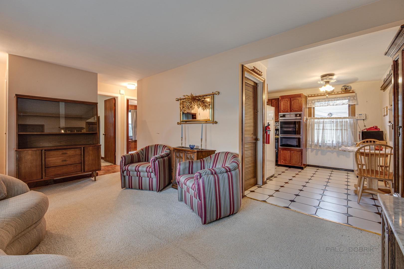 54 North Rohlwing Road Palatine, IL 60074 - Photo 5 of 24 a living room with furniture and a flat screen tv