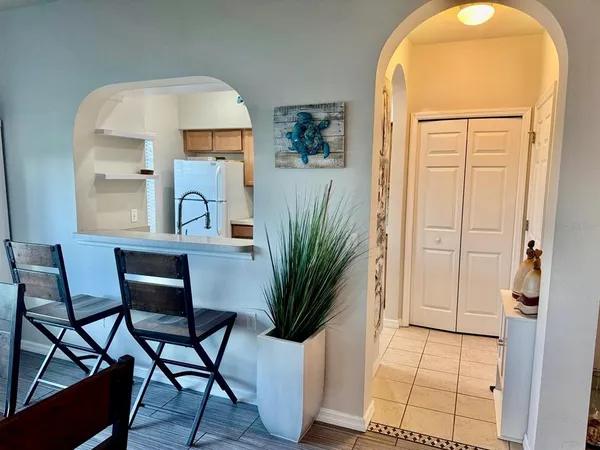 a view of a livingroom with furniture and front door