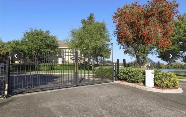 a view of a street next to a fence