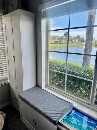 a view of a room that has a bed and a window