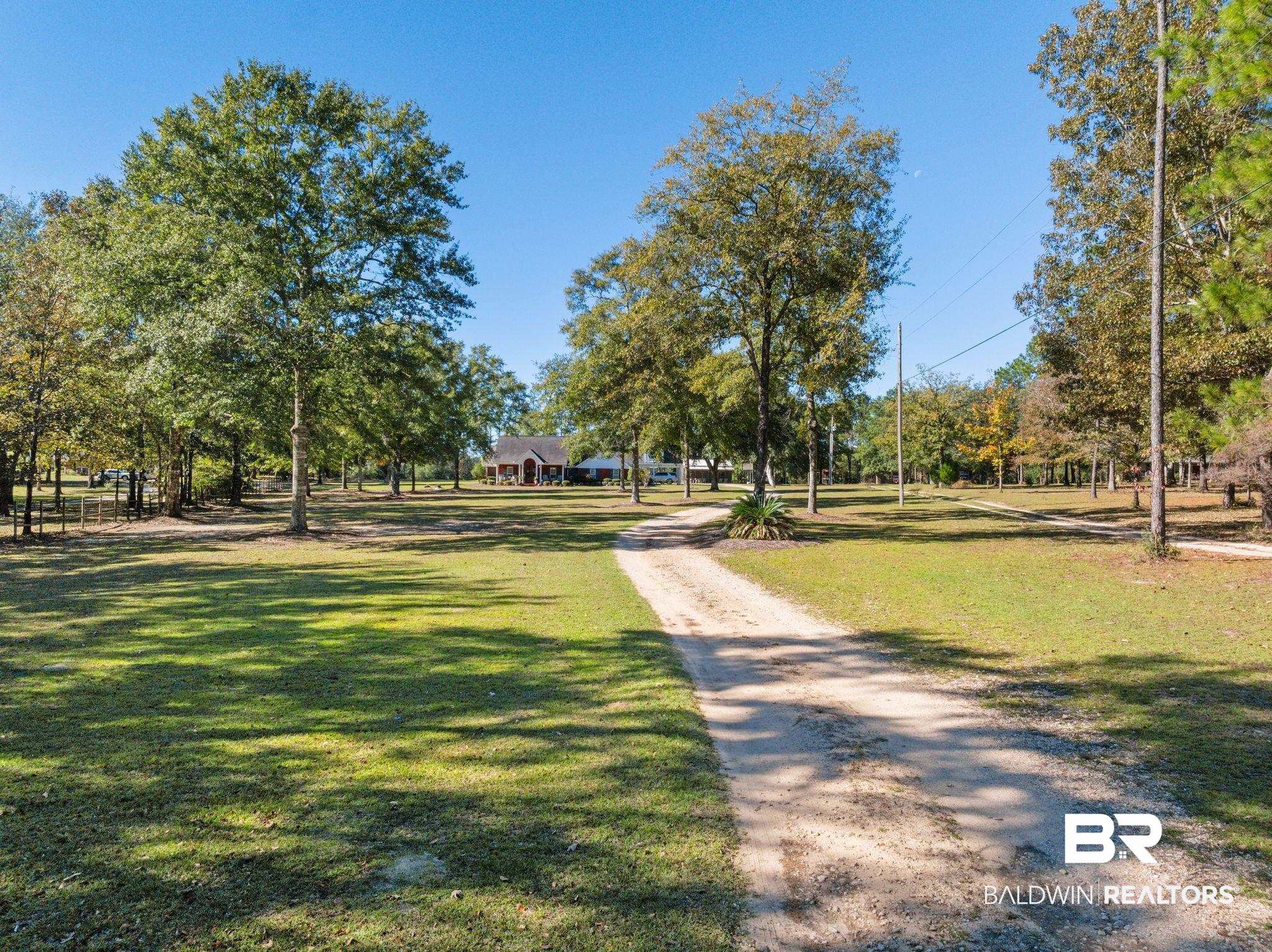 38211-d) V R Byrd Road Bay Minette, AL 36507 - Photo 48 of 58 View of property's community featuring a lawn