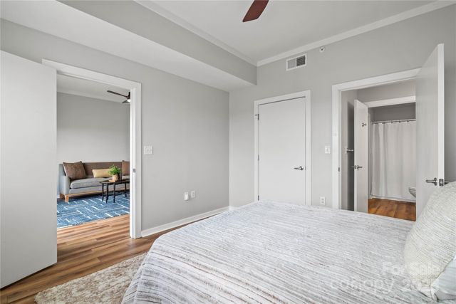 a bedroom with a bed and a table in it