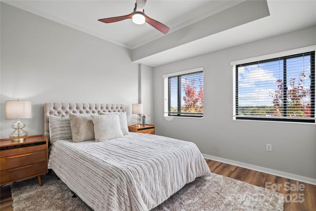 a bedroom with bed and a window