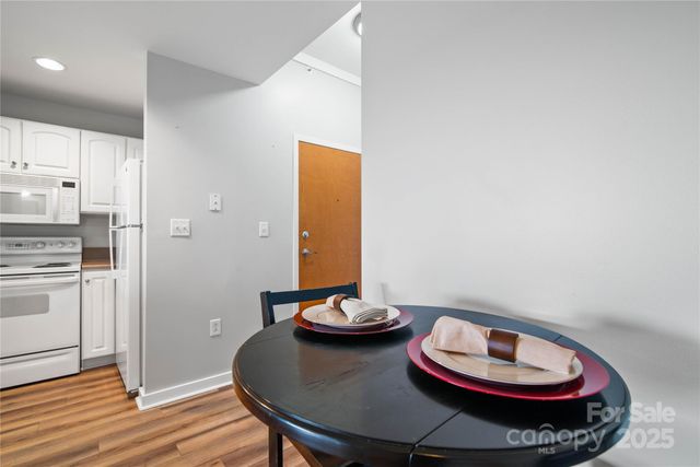 a kitchen with a appliances and a dining table