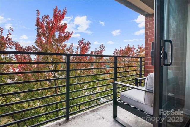 a view of a balcony with city view