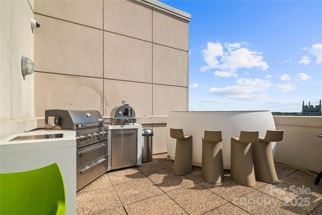 a kitchen with cabinets and chairs