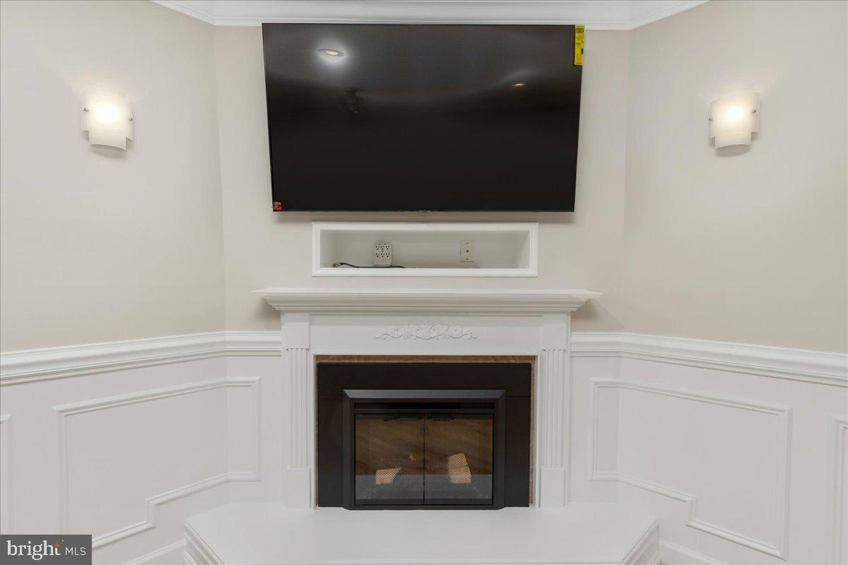 11920 Liberty Road, Unit 205A Frederick, MD 21701 - Photo 13 of 26 Cozy fireplace with new TV