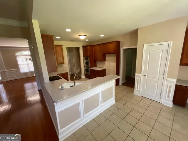 a bathroom with a sink a mirror and a shower