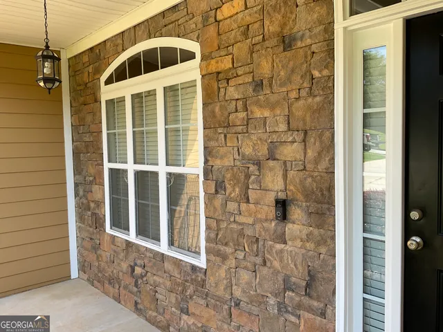 a bathroom with a shower and a sink