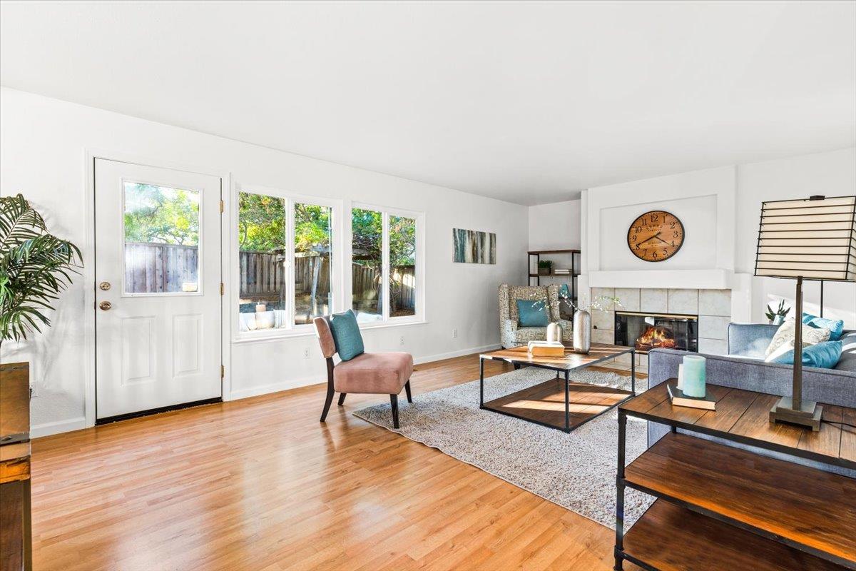9395 Durango Lane Gilroy, CA 95020 - Photo 13 of 30 a living room with fireplace furniture and a wooden floor