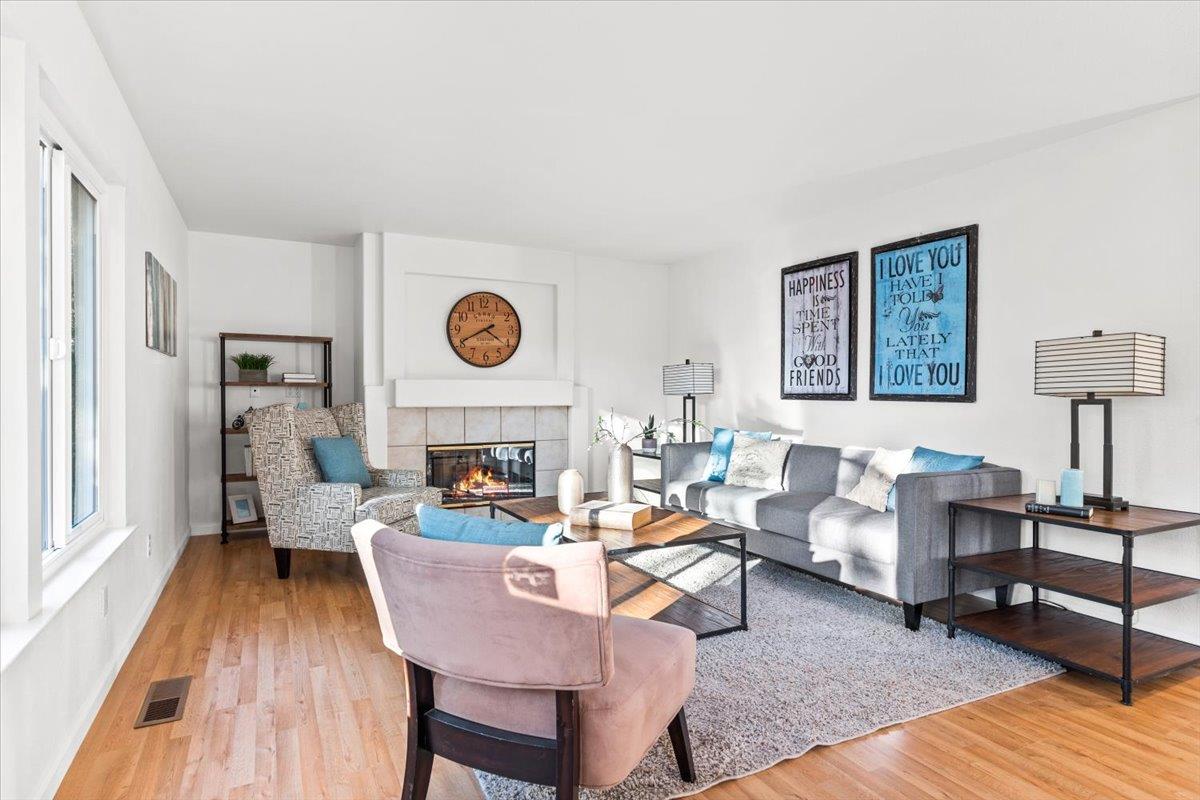 9395 Durango Lane Gilroy, CA 95020 - Photo 15 of 30 a living room with fireplace furniture and a wooden floor