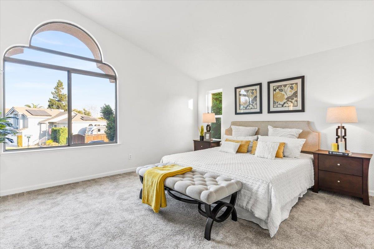 9395 Durango Lane Gilroy, CA 95020 - Photo 17 of 30 a bedroom with a bed and a painting on the wall