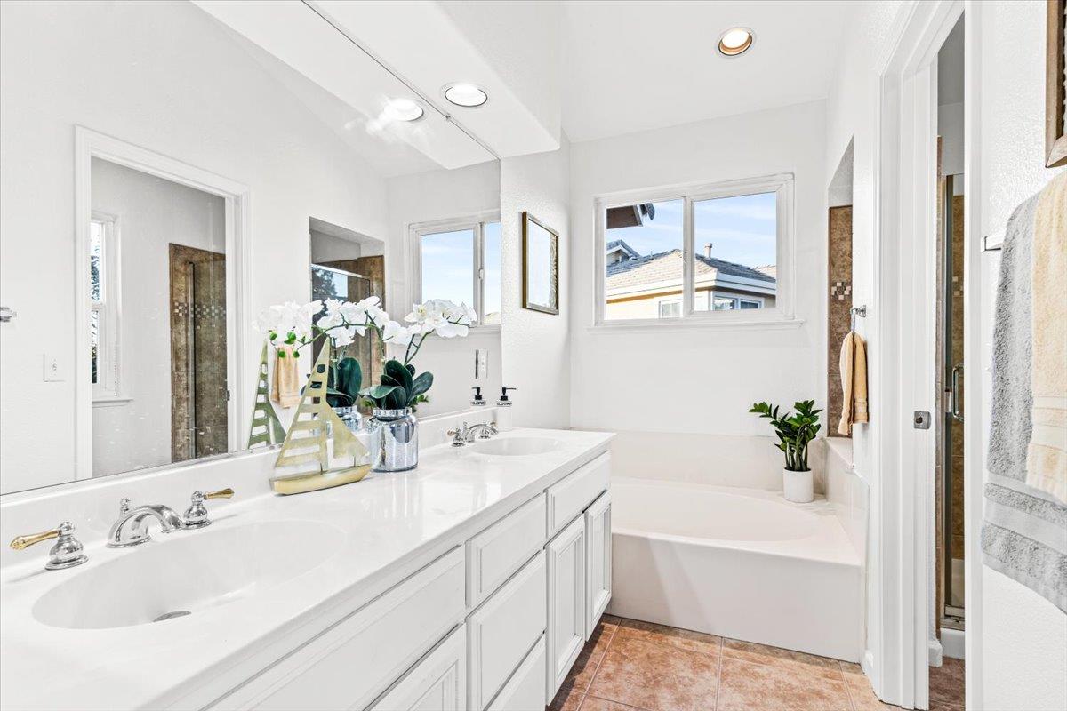 9395 Durango Lane Gilroy, CA 95020 - Photo 18 of 30 a bathroom with a tub a sink and mirror