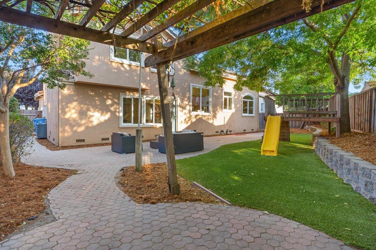 9395 Durango Lane Gilroy, CA 95020 - Photo 25 of 30 a view of a house with a backyard porch and sitting area