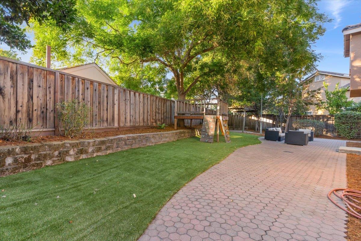 9395 Durango Lane Gilroy, CA 95020 - Photo 26 of 30 a view of a backyard with a small cabin and a chair