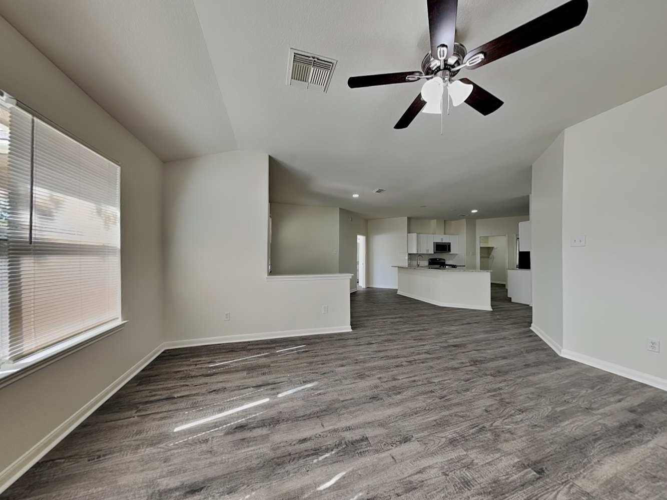 15407 Riford Drive Cypress, TX 77429 - Photo 11 of 13 a view of empty room with wooden floor and window