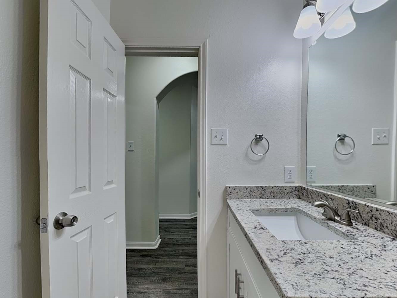 15407 Riford Drive Cypress, TX 77429 - Photo 10 of 13 a bathroom with a granite countertop sink and a mirror