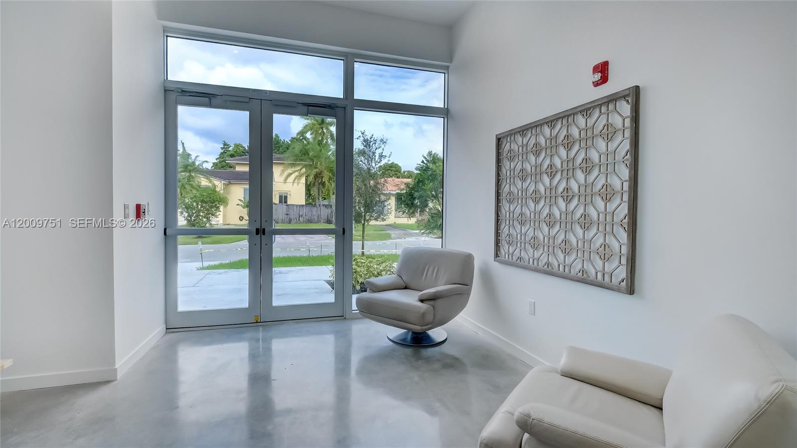 2010 Southwest 25th Terrace, Unit 404 Miami, FL 33133 - Photo 3 of 17 a living room with furniture and a large window