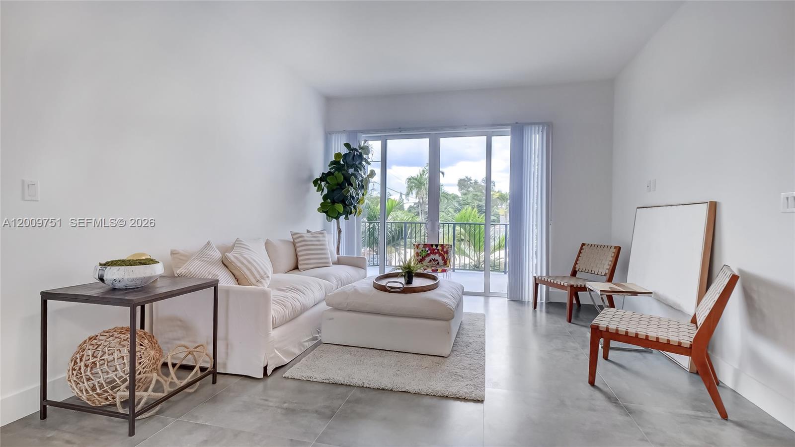 2010 Southwest 25th Terrace, Unit 404 Miami, FL 33133 - Photo 6 of 17 a living room with furniture and a large window