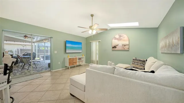 a kitchen with stainless steel appliances granite countertop a sink refrigerator and cabinets