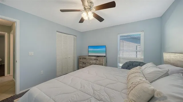 a view of a backyard with wooden floor and seating
