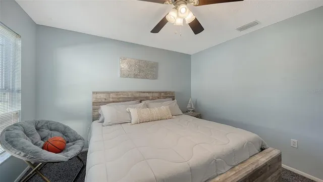 a view of a backyard with sitting area